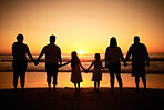Big family silhouette on beach with sea waves, sunset on the horizon and holding hands for development wellness, support and love. Children and group of people watch ocean on dark, orange sky mockup