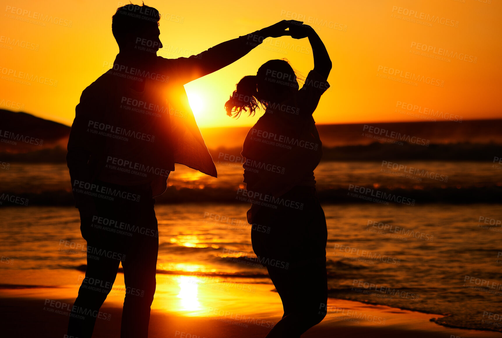 Buy stock photo Sunset, dance and silhouette of couple by the beach together for love, travel and Puerto Rico holiday. Summer, sunrise and nature with man and woman dancing by the sea for vacation, happy and relax