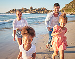 Beach, summer and travel with family running on sand in Mexico for vacation fun with kids. Happy mother and father bond together chasing excited children on ocean holiday break in the sun.


