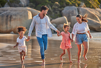 Buy stock photo Love, freedom and family at the beach, walking and holding hands, relax in water and nature. Freedom, wellness and vacation with happy family laughing and bond, enjoy walk in sand and time together