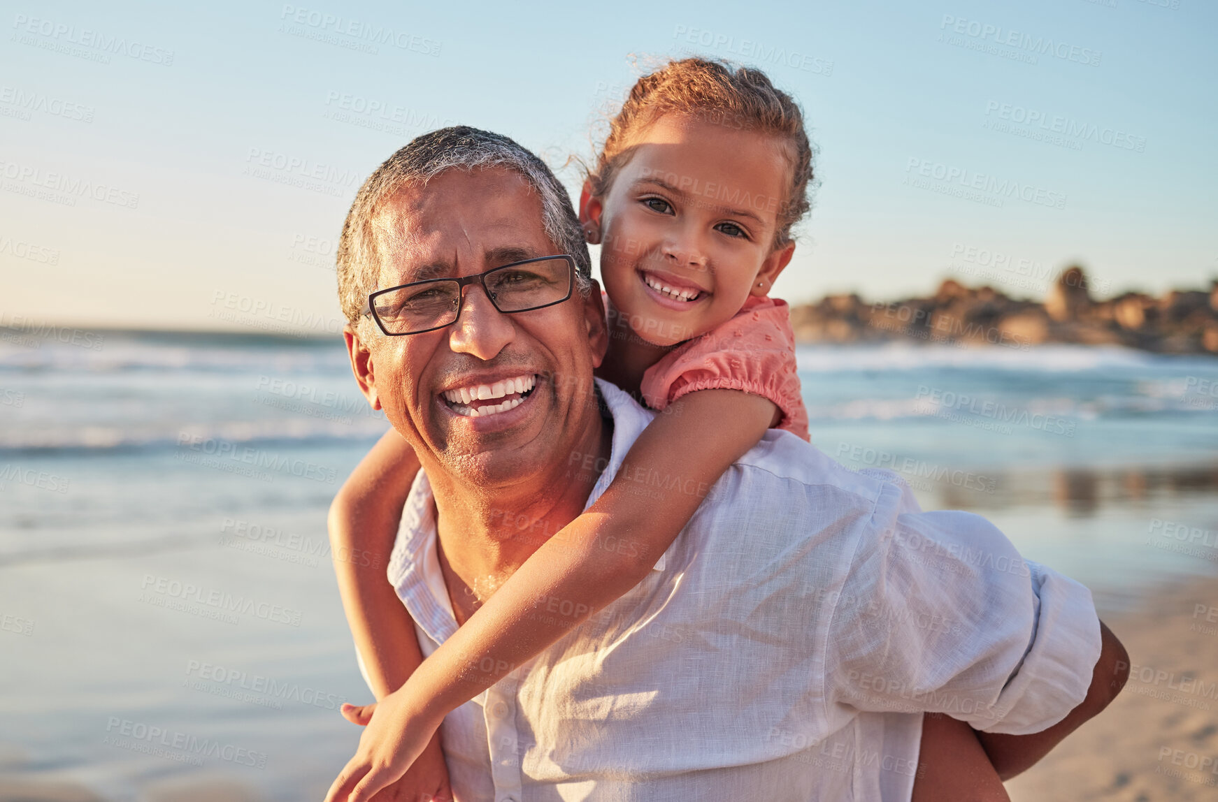 Buy stock photo Family, child and grandpa on beach vacation with smile, love and fun senior man carrying girl on back on tropical summer trip. Active grandparent and happy kid laughing during piggy back ride by sea