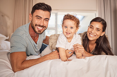 Buy stock photo Mother, father and baby boy bonding in house, family home or hotel bedroom with trust, love or security. Portrait, smile or happy Brazilian man, woman or parents with playful small son, child or kid