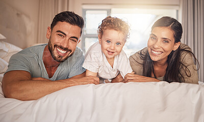 Buy stock photo Mother, father and child bonding in bedroom happy, love and care together in morning at family home. Portrait of joy, excited and young parents of mom, dad and youth son smile with happiness at house