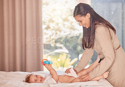Buy stock photo Mother, baby and diaper change on bed for care and wellness of smiling infant son in bedroom. Mom cleaning disposable underwear for comfort of happy, calm and relaxed toddler in family home.
