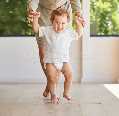 Buy stock photo Development, walking and baby learning with mother helping support her childs growth, progress and first steps. Smile, happy and parent holding hands with her kid teaching her excited son to stand 