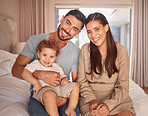 Mom, dad and baby on bed with smile in room together on holiday or vacation in Miami. Parents, bedroom and happy child in bedroom show love in portrait of family in home, apartment or hotel on travel