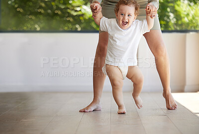 Buy stock photo Baby boy, learning and walking with mom in support, first steps and healthy body development for children. Mother holding hands in teaching excited, smile and happy young kid balance, care and growth