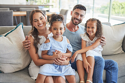 Buy stock photo Father, mother and children smile, love and relax on the sofa together in the house living room. Portrait of happy family  bonding in a lounge with happiness, care and trust in a healthy relationship