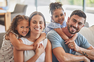 Buy stock photo Mother, dad and girl children hug on sofa together bonding, love and care in living room at family home. Young, excited people or happy family of parents and girl children smile for fun and happiness