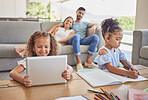 Learning, kid writing and girl with tablet watching educational video in living room while mom and dad relax on sofa in background. Education, elearning and children drawing in family home in Brazil.