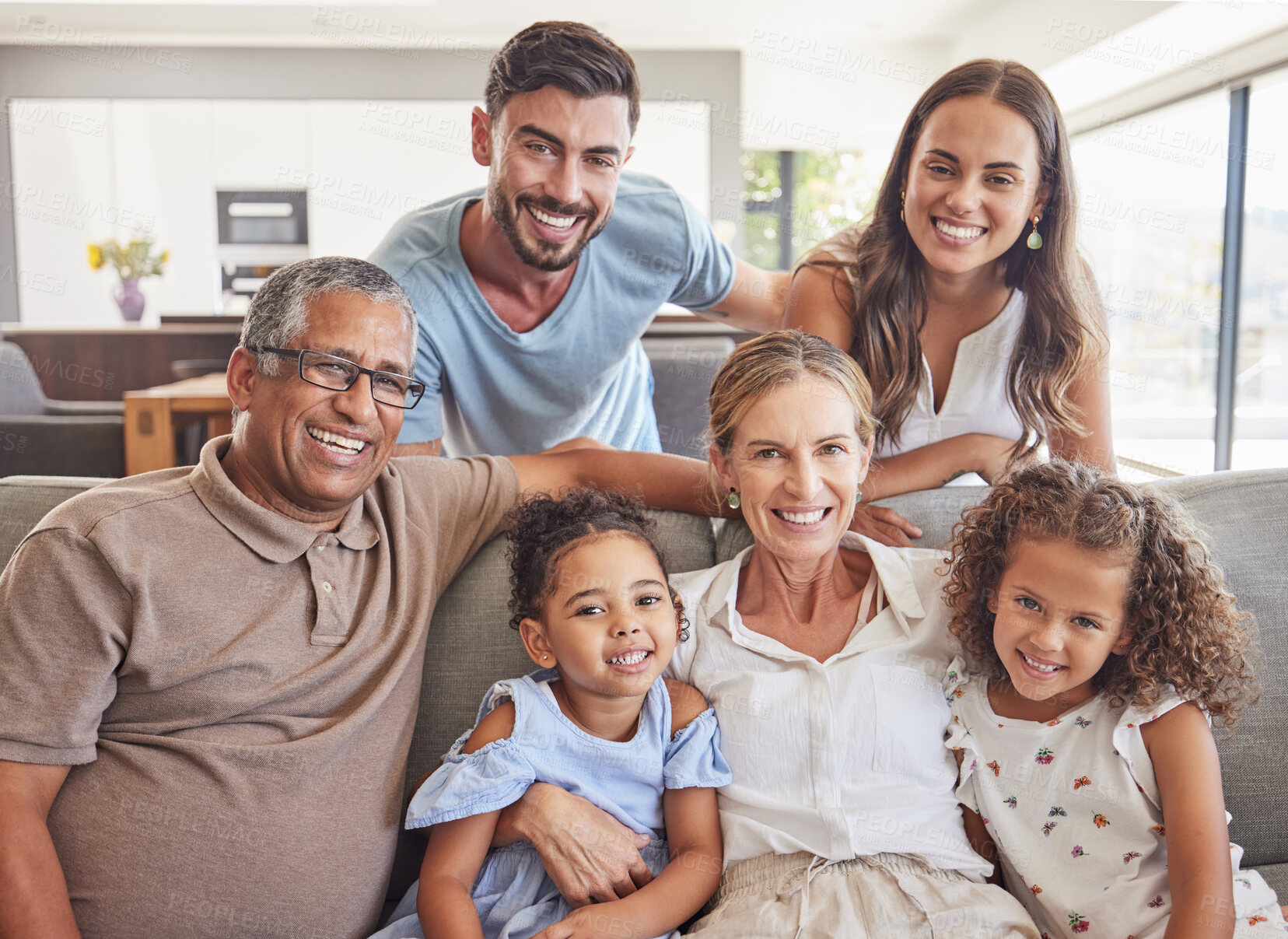 Buy stock photo Happy big family, smile and sofa portrait in home living room, bonding and caring. Love, diversity and grandparents, parents and girls spending good quality time together in relax, support and care.