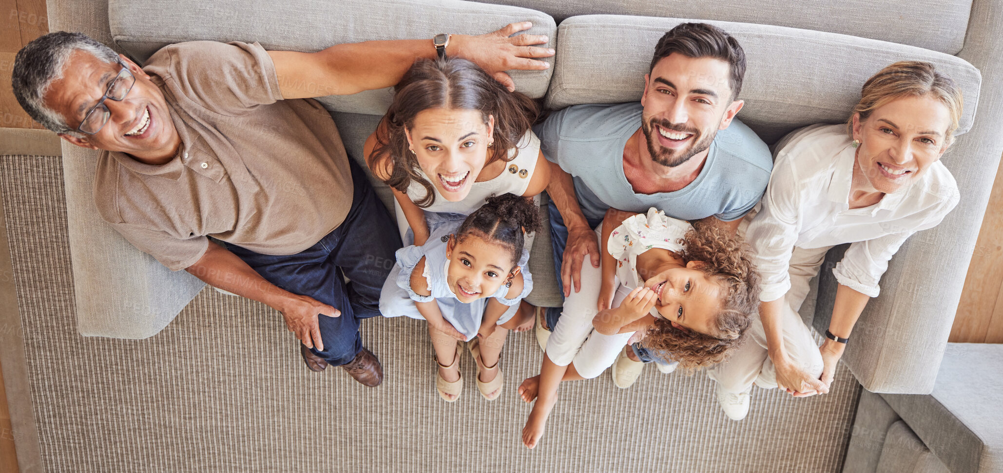 Buy stock photo Children, parents and grandparents on sofa with above view and generations of family spending time together. Love, diversity and couple with girl kids, grandma and grandpa relax and smile at home.