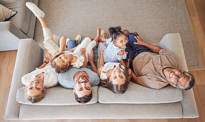 Buy stock photo Family, children and love with kids from above next to grandparents and parents on a sofa in the living room of their house. Portrait, smile and happy with a girl, sister and senior relatives at home