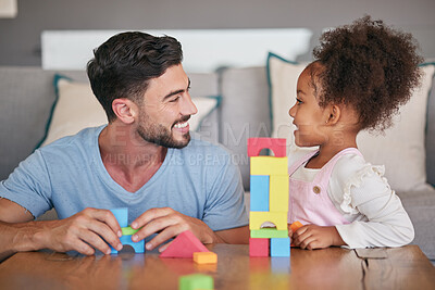 Buy stock photo Children, family and education with a girl and her father playing with building blocks in the living room of their home. Love, learning and toys with a foster parent and adopted child together