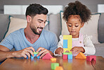 Father, child and fun building blocks on table playing with little girl in the living room at home. Happy dad smiling in playful build activity with colorful shapes, toys and daughter in development