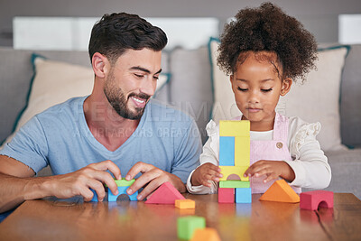 Buy stock photo Father, adopted child and building blocks on table playing with little girl in living room at home. Happy dad smiling in playful build activity with colorful shapes, toys and daughter in development