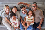 Smile, happy big family on sofa and top view of generations, grandparents and parents together in living room. Diversity portrait, love and couple, girl kids and grandpa and grandma relax at home.
