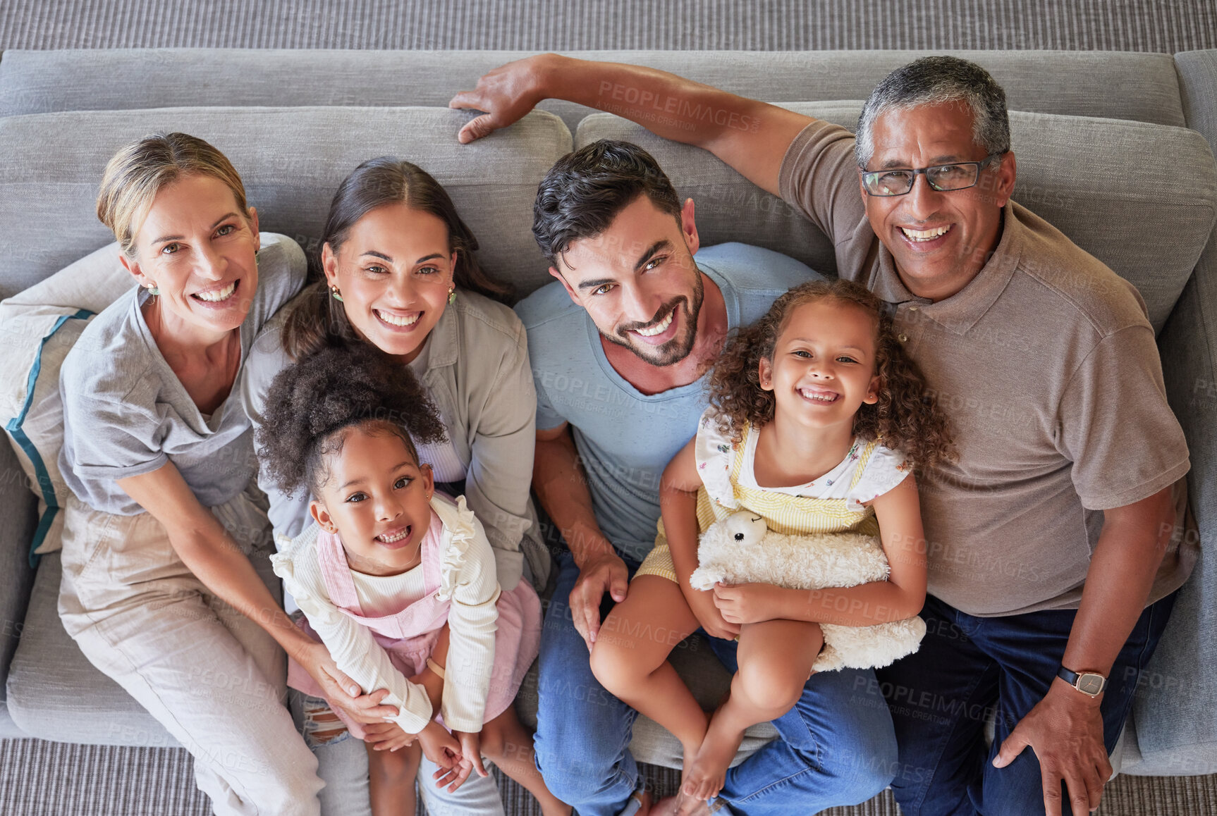 Buy stock photo Smile, happy big family on sofa and top view of generations, grandparents and parents together in living room. Diversity portrait, love and couple, girl kids and grandpa and grandma relax at home.
