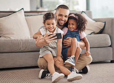 Buy stock photo Family, selfie and happy children sitting on lounge carpet at home with phone and taking photo or doing video call together. Love, bonding and care of single parent man with girl kids in brazil house