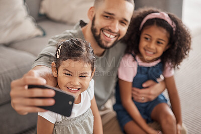 Buy stock photo Love, father and children selfie on smartphone for cute bonding memory together in living room. Social media photograph of Mexican dad and young children relaxing in family home on weekend.

