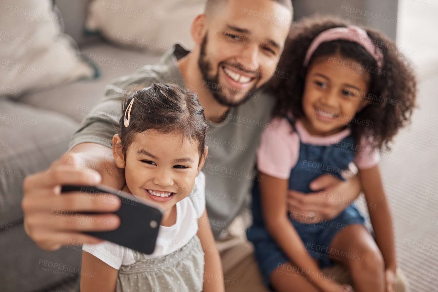 Buy stock photo Love, father and children selfie on smartphone for cute bonding memory together in living room. Social media photograph of Mexican dad and young children relaxing in family home on weekend.

