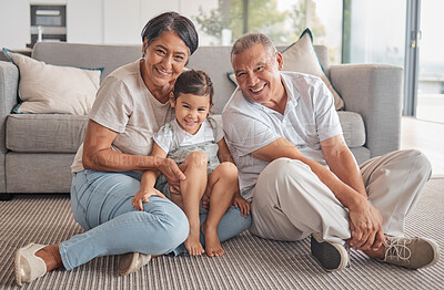 Buy stock photo Girl, hug and grandparents with love, care and relax in family home together. Portrait of happy child, smile senior grandma and laugh elderly grandpa bond and play together in the living room floor