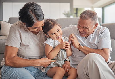 Buy stock photo Grandparents, girl and sofa in house, happy and playing together in bonding time. Grandmother, grandpa and child on couch in living room, smile and fun in family home for visit or holiday in Jakarta