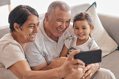 Buy stock photo Family, grandparents and selfie on smartphone with child happy and excited to bond with relatives. Phone photograph for senior grandmother and grandpa babysitting grandchild in Mexico home.


