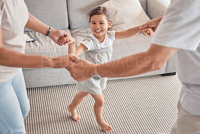 Buy stock photo Happy family, child and playing circle game while bonding, fun and holding hands with energy, happiness and joy with energetic asian girl. Kid, play and support with man and woman doing dance at home