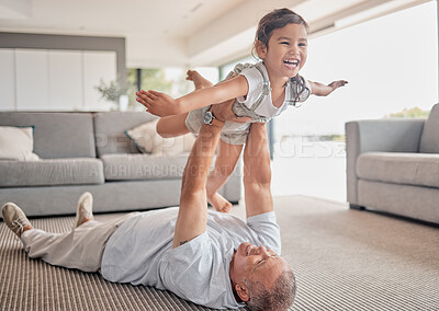 Buy stock photo Love, happy grandfather and girl play in living room and laugh, fun and smile together. Grandparent lifting grandchild at home in lounge and enjoy bonding, carefree and relax on floor on weekend.