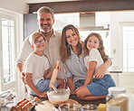 Kitchen, cooking and family in portrait with breakfast food together and smile for support, love and care. Happy parents or father and mother teaching children or kids to cook or bake for development