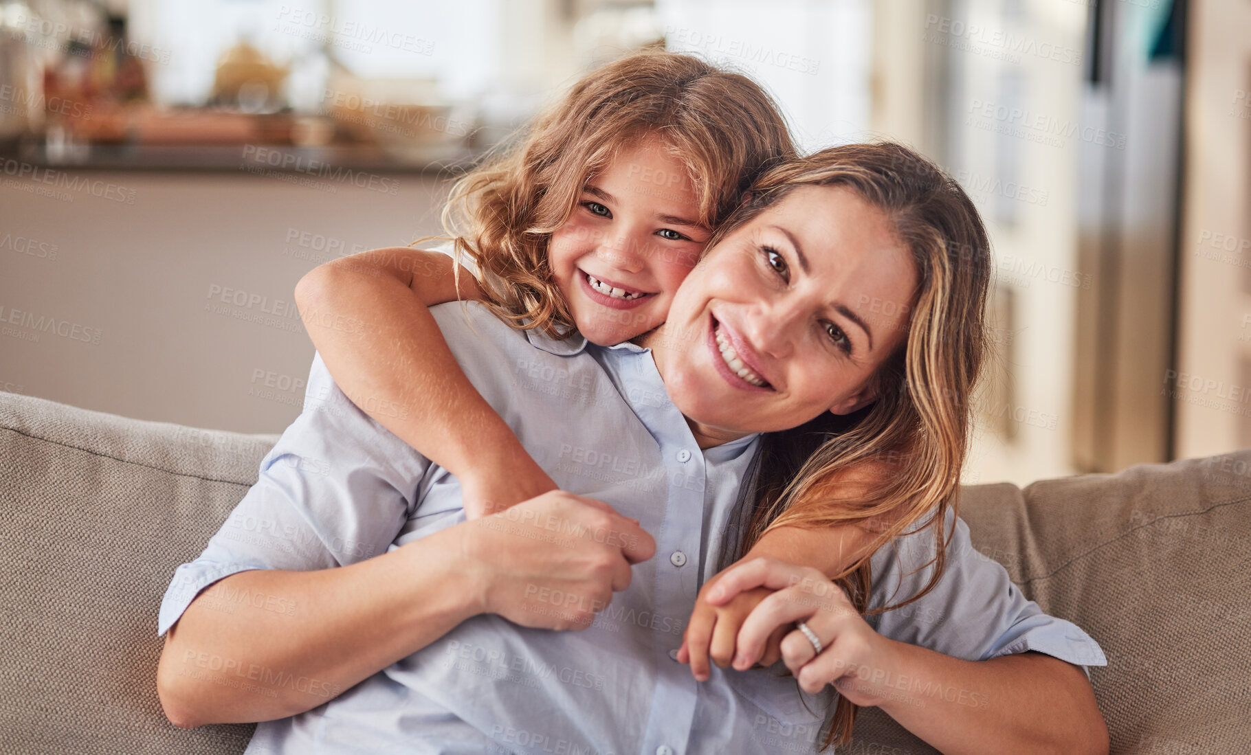 Buy stock photo Girl, mother and sofa show love in home, happy and smile together in living room. Mom, child and couch show happiness, hug and relax in school holiday in portrait at family home in Dallas, Texas