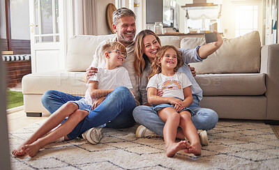 Buy stock photo Relax, phone and selfie by happy family on living room floor, bonding and taking photo in their home together. Love, children and parents enjoying time together, having fun and smile for pictures