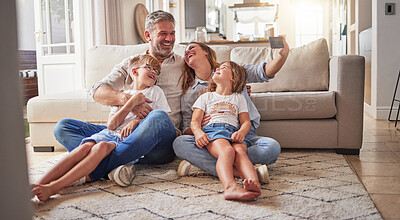 Buy stock photo Happy, relax and selfie with family in living room for love, media and support together. Smile, support and and internet with parents and children posing for phone camera at home for social media