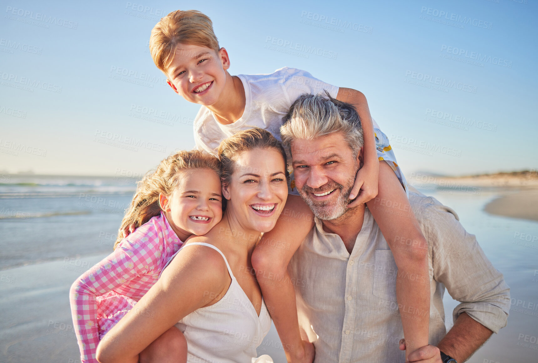 Buy stock photo Travel, love and beach portrait with happy family on summer vacation, bonding and playing on ocean holiday. Freedom, nature and children looking excited with parents, embracing and laughing together