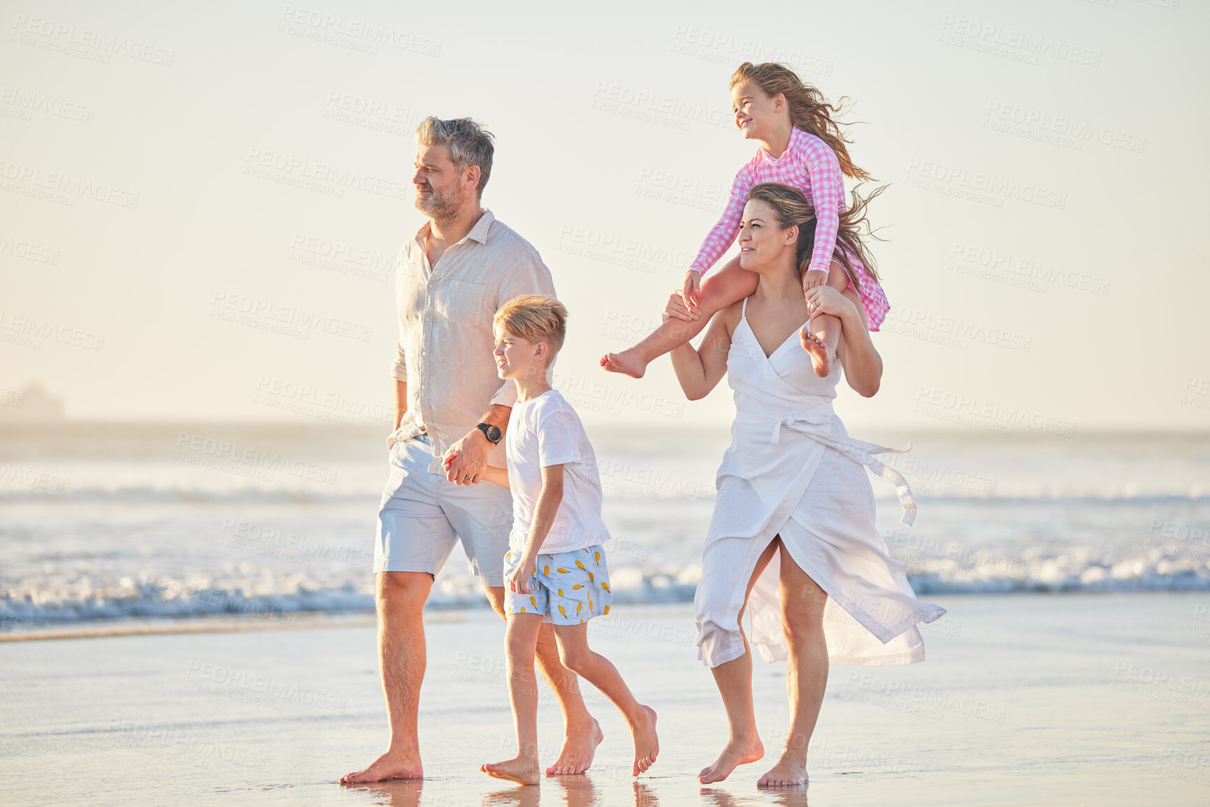 Buy stock photo Family, beach and walking kids on sand in nature for summer spending quality time. Sea water, ocean waves and walking of a happy mother, man and children holding hands with happiness in the sun