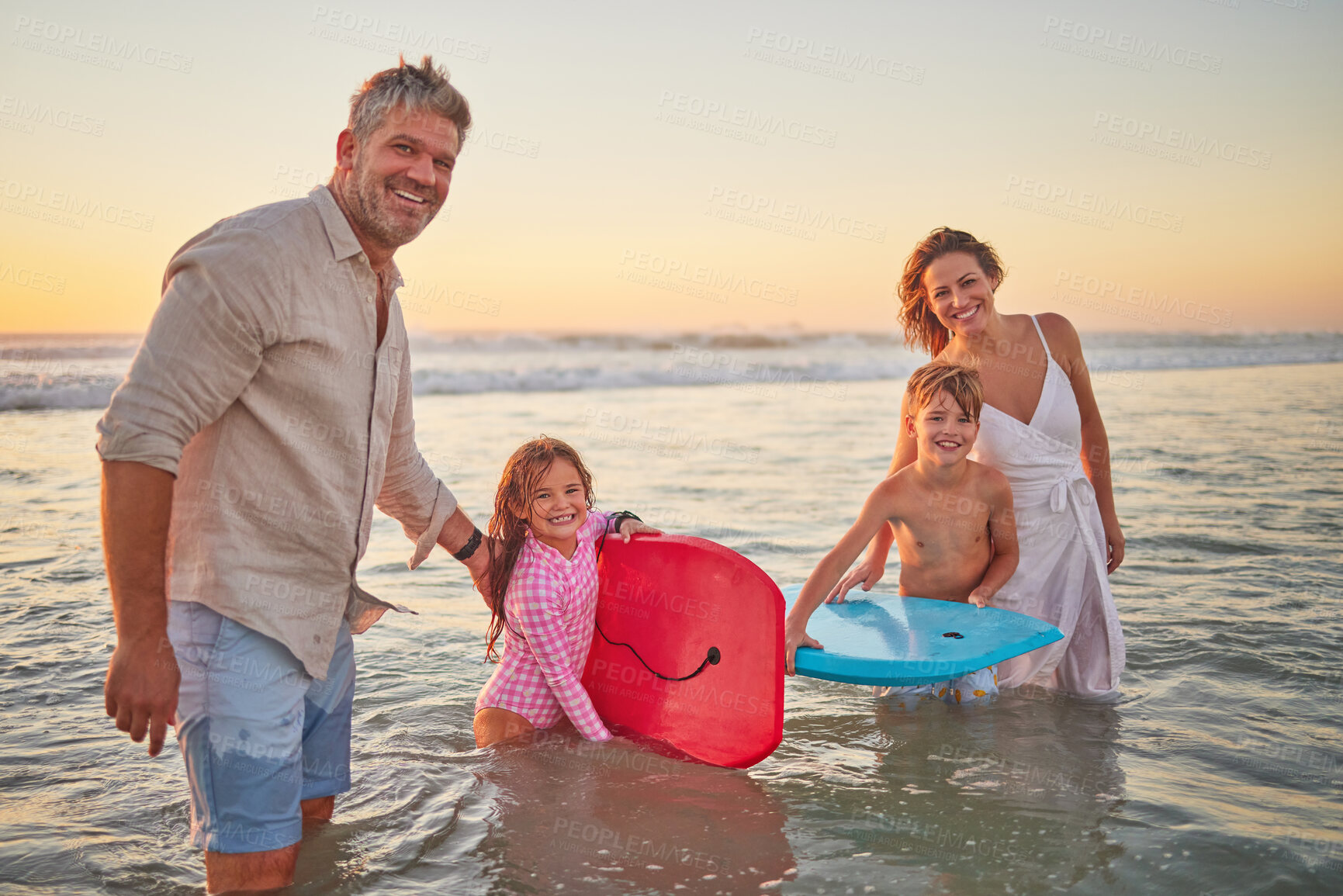 Buy stock photo Family, beach and body board, kids with parents in water on summer holiday. Mom, dad and children surfing in ocean at sunset in Australia. Freedom, fun and vacation, happy man and woman play in waves