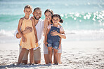 Family beach, children travel and parents on holiday with kids in the Maldives during summer together. Portrait of young girl siblings happy on sea vacation by the ocean with mother and father