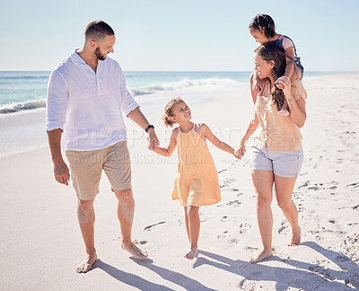 Buy stock photo Travel, relax and holding hands with family at beach together for Maldives holiday for love, happy or summer. Support, smile or trust with parents and children walking by the sea for wellness holiday