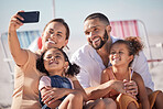 Selfie, phone and happy family at summer beach holiday enjoy vacation travel together on Hawaii ocean sand. Mother, father and girl children with smartphone photography smile, joy and excited in Bali