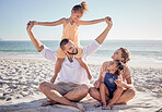 Love, beach and a happy family bonding in sand, playing and having fun on summer vacation in Mexico. Kids, parents and ocean view with excited girl enjoying playful game with her mother and father