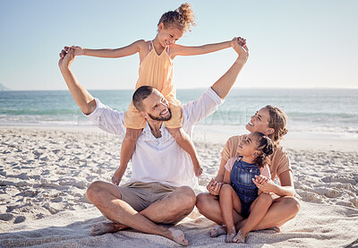 Buy stock photo Love, beach and a happy family bonding in sand, playing and having fun on summer vacation in Mexico. Kids, parents and ocean view with excited girl enjoying playful game with her mother and father