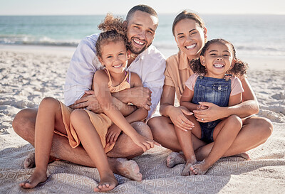 Buy stock photo Happy, family and relax with smile on beach for summer vacation and bonding time together in nature. Mother, father and children relaxing on sandy shore smiling for holiday break or weekend travel