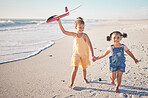 Beach, plane and happy with children running on Cancun holiday for summer, travel or family. Freedom, support and smile with young girl and sisters holding hands for relax, friends and ocean vacation