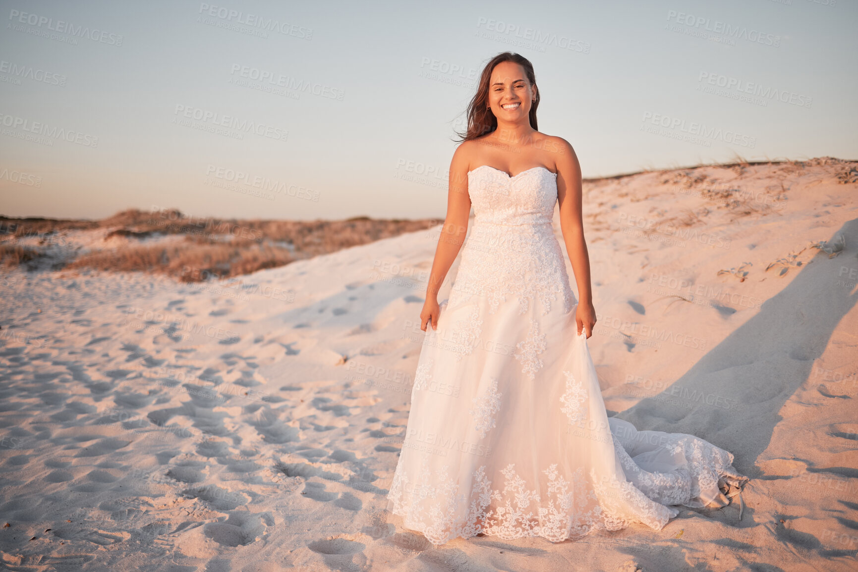 Buy stock photo Beach wedding, bride and happy woman in a white dress while standing in sand and sun enjoying her special day at a tropical and romantic destination. Portrait of Columbia female by sea for honeymoon