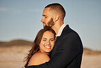 Wedding, love and happy with couple at sunset and hug together for celebration, event or beach venue. Smile, support and commitment with man and woman holding in embrace for marriage, goals and trust