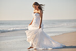 Nature, waves and a bride walking on beach in Australia on  wedding day in summer. Happy barefoot woman in luxury designer dress, feet on sand on a walk by ocean after marriage ceremony at the sea.