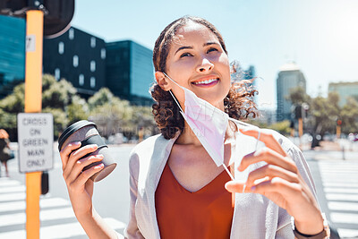 Buy stock photo Business woman take off mask at end of covid with a happy smile in the city with a cup of coffee. Pandemic regulations safety update or social distancing change in public and business environment