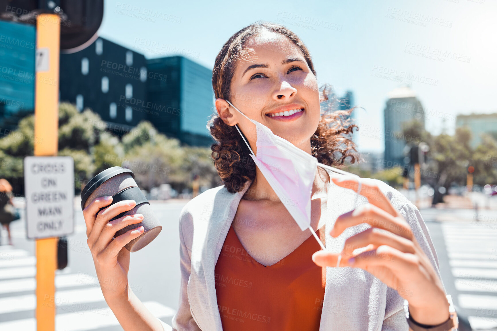 Buy stock photo Business woman take off mask at end of covid with a happy smile in the city with a cup of coffee. Pandemic regulations safety update or social distancing change in public and business environment