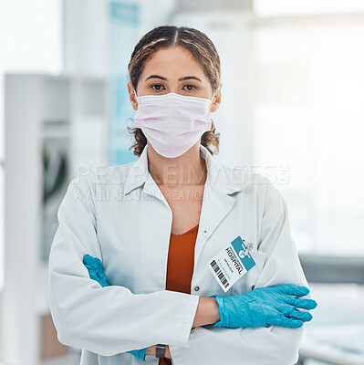 Buy stock photo Covid, medical and trust with doctor and arms crossed with a face mask in hospital for innovation, support or vision. Medicine, trust and leadership with portrait of healthcare employee in clinic